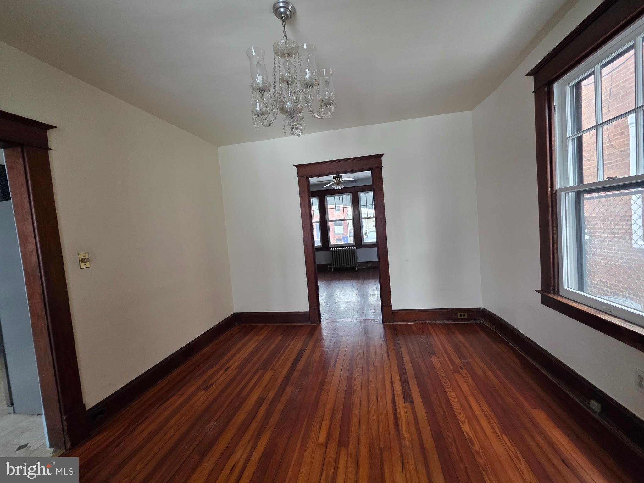 104 East 7th Street Frederick, MD 21701 - Photo 11 of 28 a view of empty room with wooden floor and fan