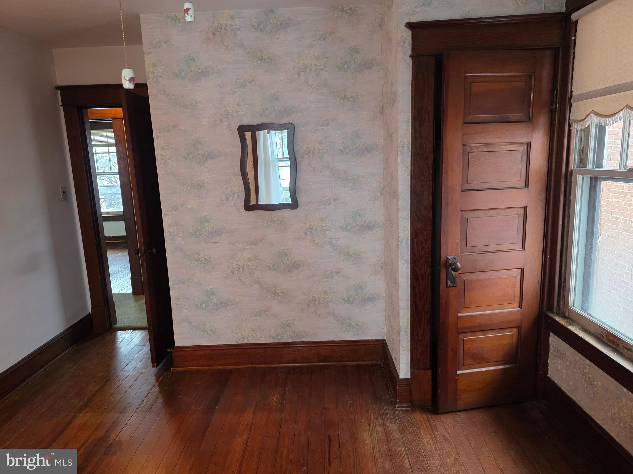 104 East 7th Street Frederick, MD 21701 - Photo 18 of 28 wooden floor in an empty room and a mirror