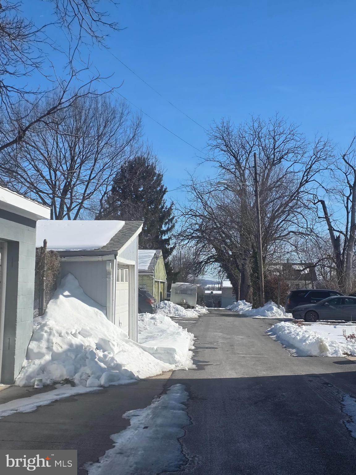 104 East 7th Street Frederick, MD 21701 - Photo 4 of 28 a view of white house with a yard covered in snow