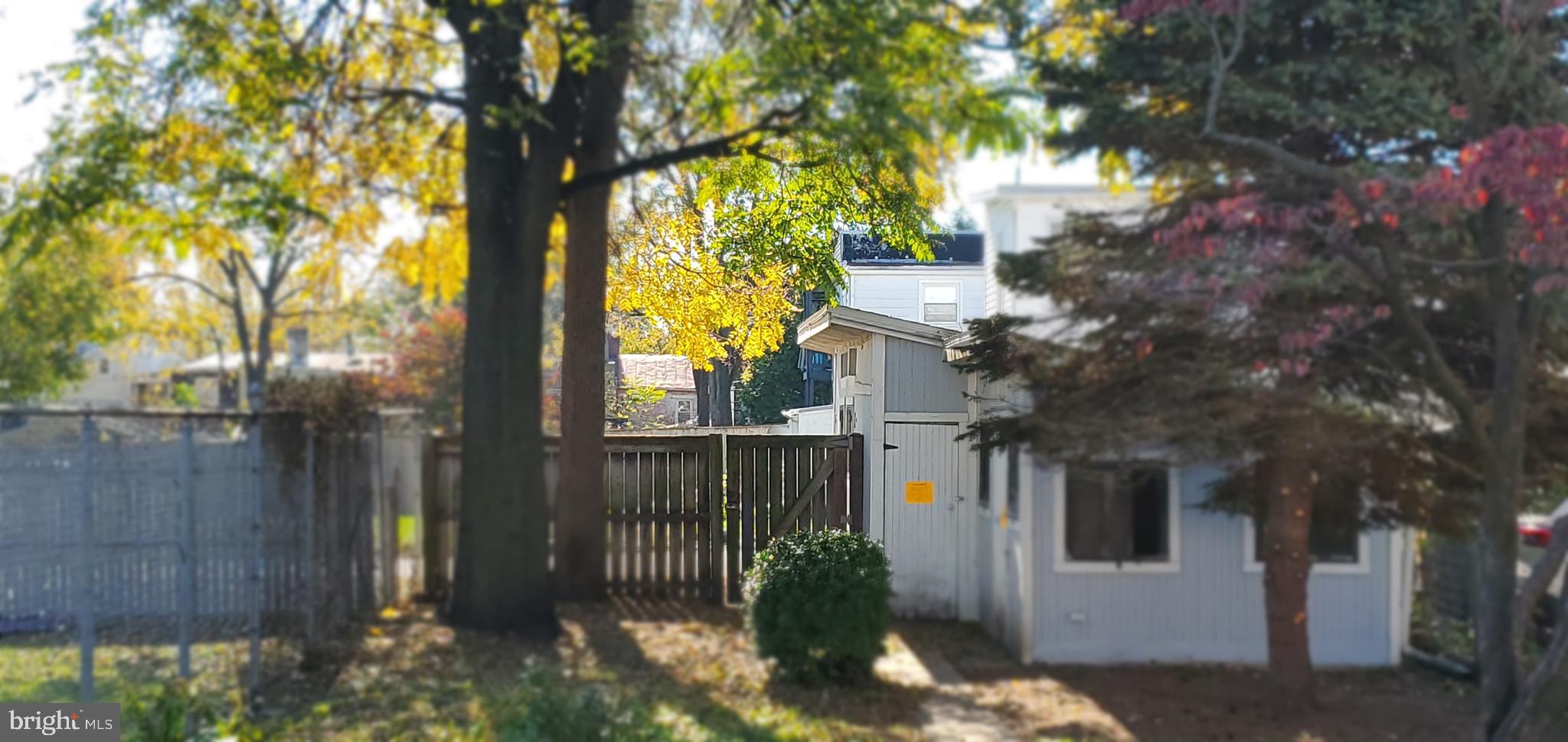 104 East 7th Street Frederick, MD 21701 - Photo 5 of 28 a view of a wooden fence next to a large tree