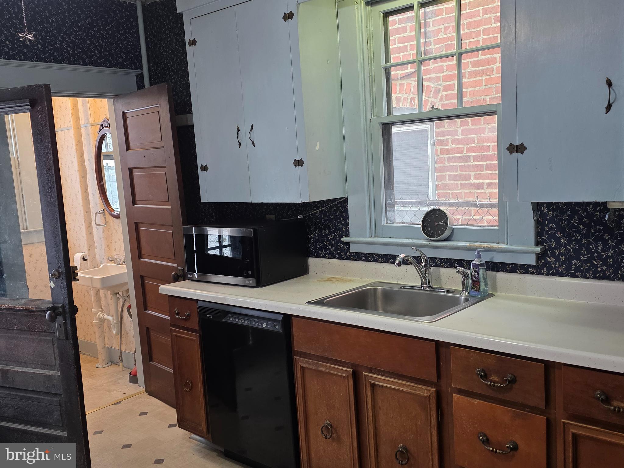 104 East 7th Street Frederick, MD 21701 - Photo 8 of 28 a kitchen with a sink and a window