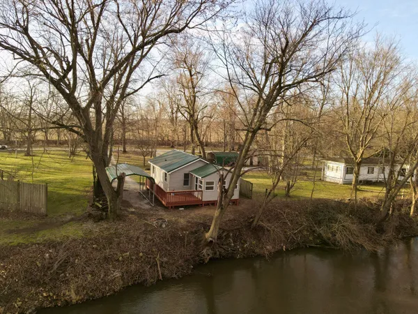 a view of a lake with houses covered with lake