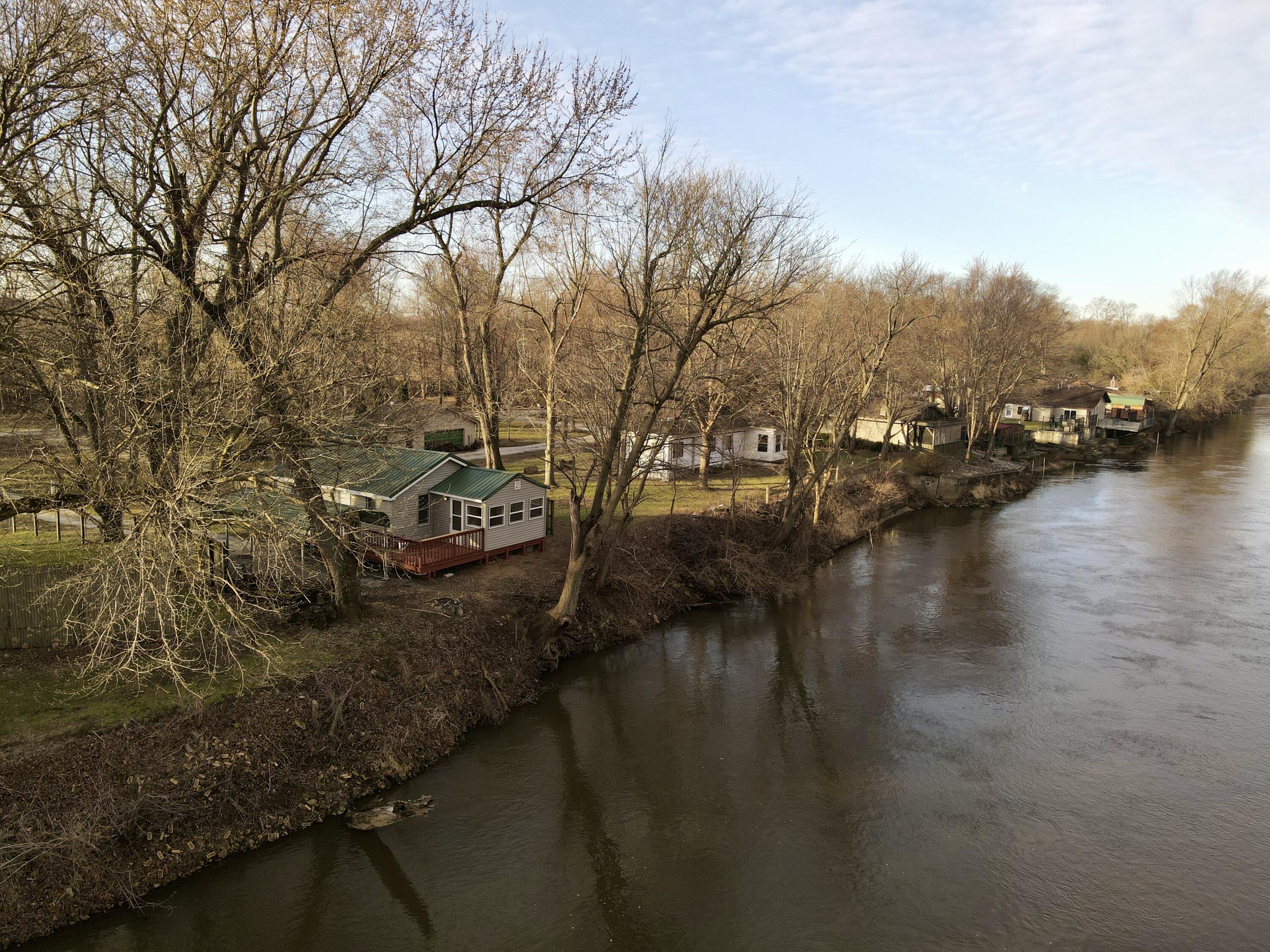 6742 Ramsey Road Hebron, IN 46341 - Photo 2 of 30 a view of river covered by trees and houses
