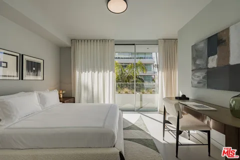 a dining room with a large window and table or chairs