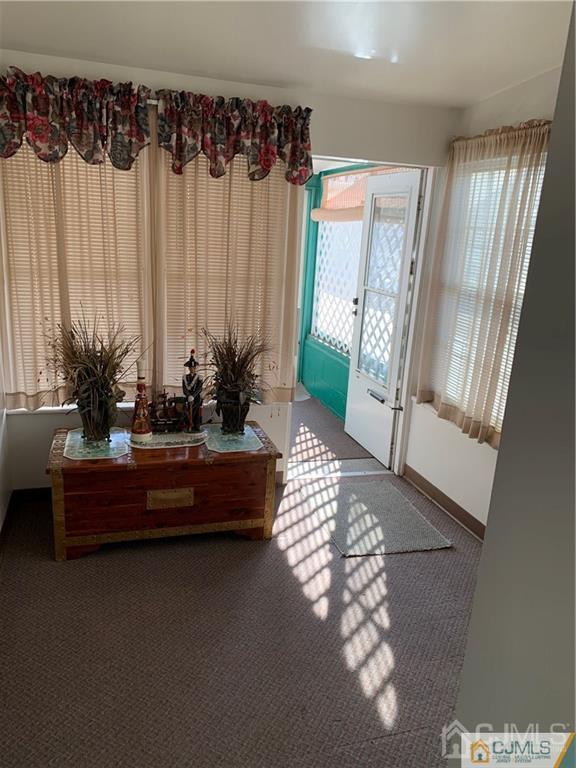 519 A Morristown Road, Unit A Old Bridge, NJ 07747 - Photo 15 of 17 a living room with furniture and a large window