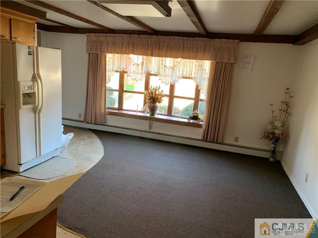 519 A Morristown Road, Unit A Old Bridge, NJ 07747 - Photo 3 of 17 a view of table and window