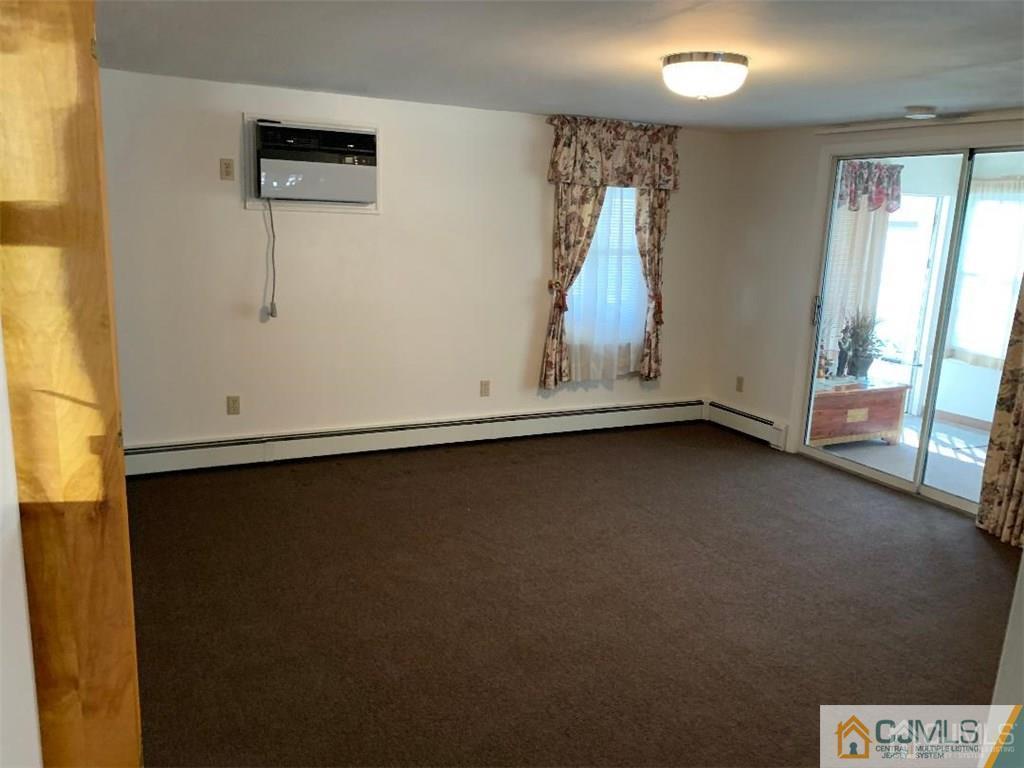 519 A Morristown Road, Unit A Old Bridge, NJ 07747 - Photo 6 of 17 a view of room with window and air conditioner