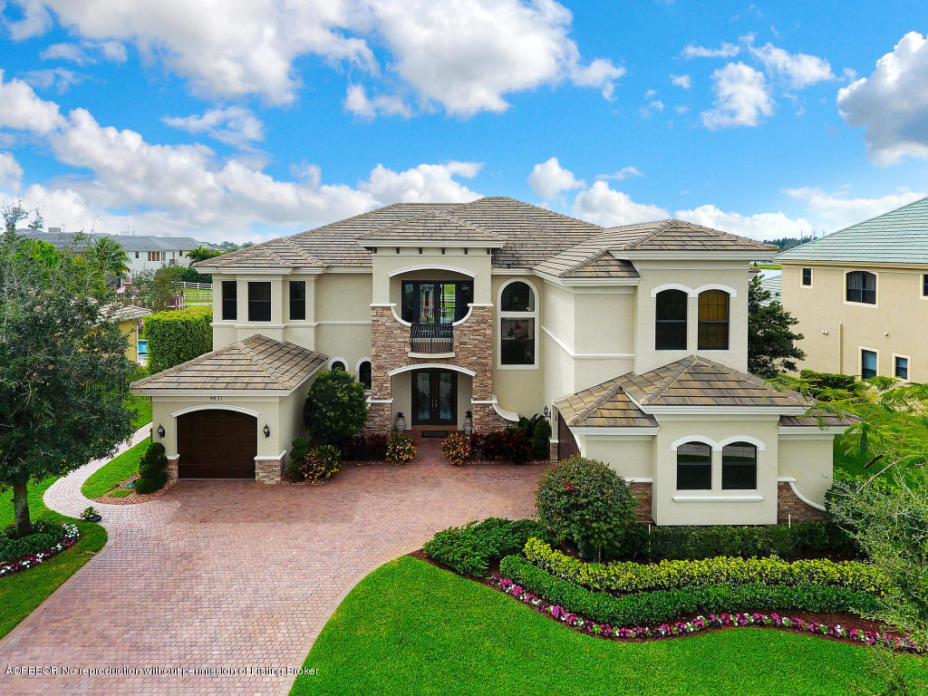 9831 Equus Circle Boynton Beach, FL 33472 - Photo 1 of 44 a front view of a house with a yard and garage