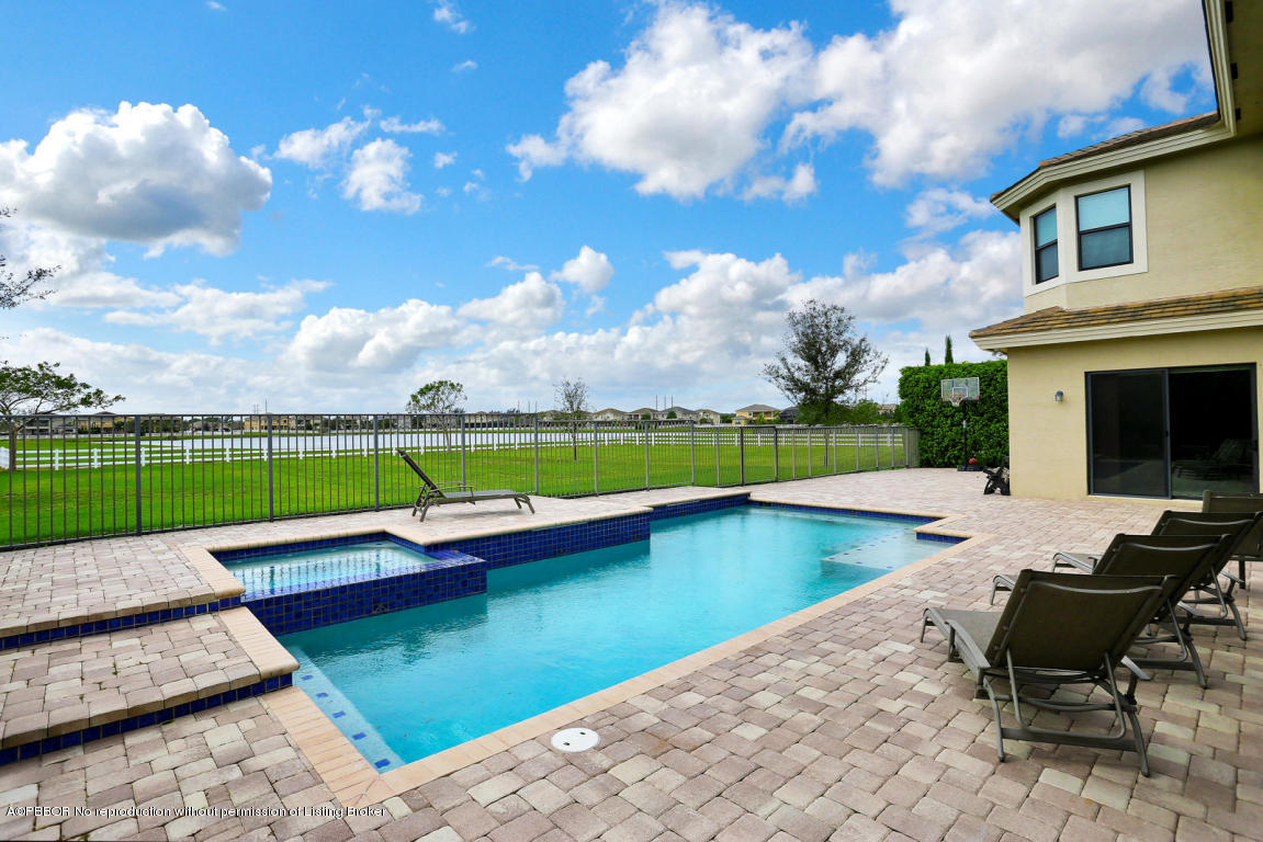 9831 Equus Circle Boynton Beach, FL 33472 - Photo 2 of 44 a view of swimming pool with lounge chair
