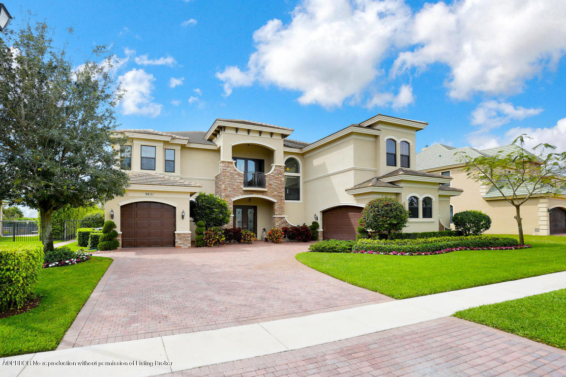 9831 Equus Circle Boynton Beach, FL 33472 - Photo 12 of 44 a front view of a house with a yard and garage
