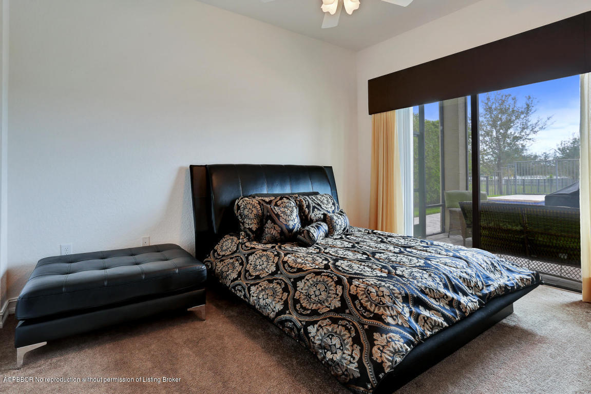 9831 Equus Circle Boynton Beach, FL 33472 - Photo 19 of 44 a bedroom with a bed and a large window