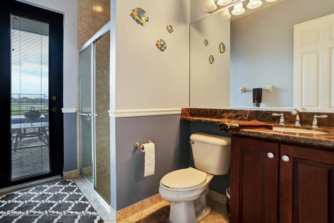 9831 Equus Circle Boynton Beach, FL 33472 - Photo 20 of 44 a bathroom with a sink and a toilet