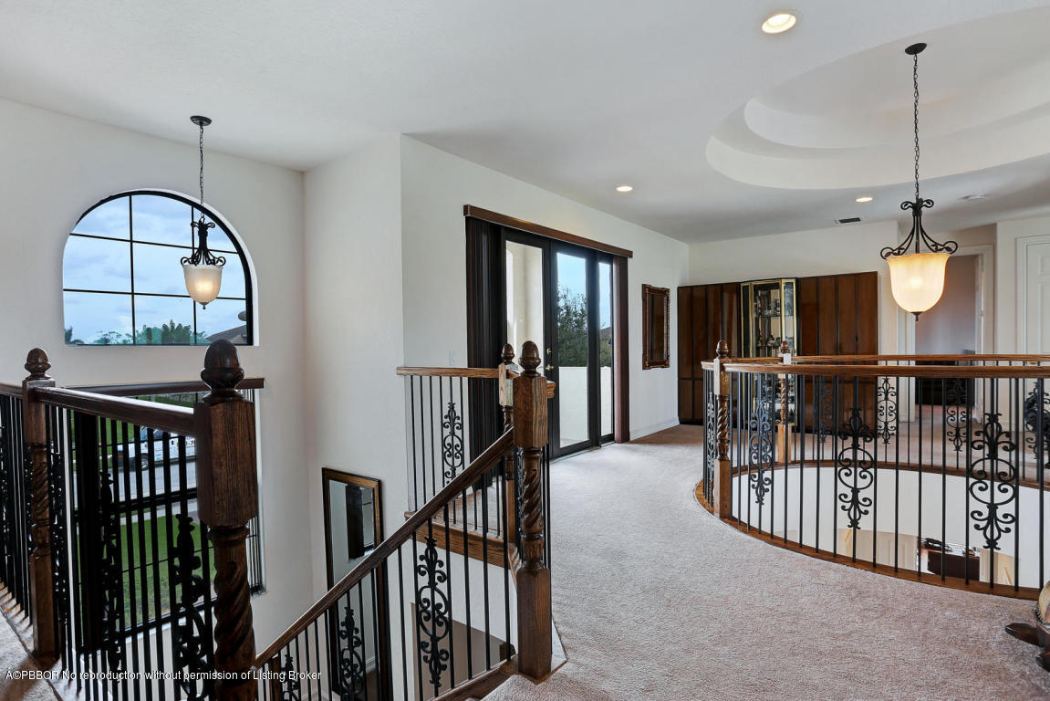 9831 Equus Circle Boynton Beach, FL 33472 - Photo 21 of 44 a view of a hallway with wooden floor and entryway