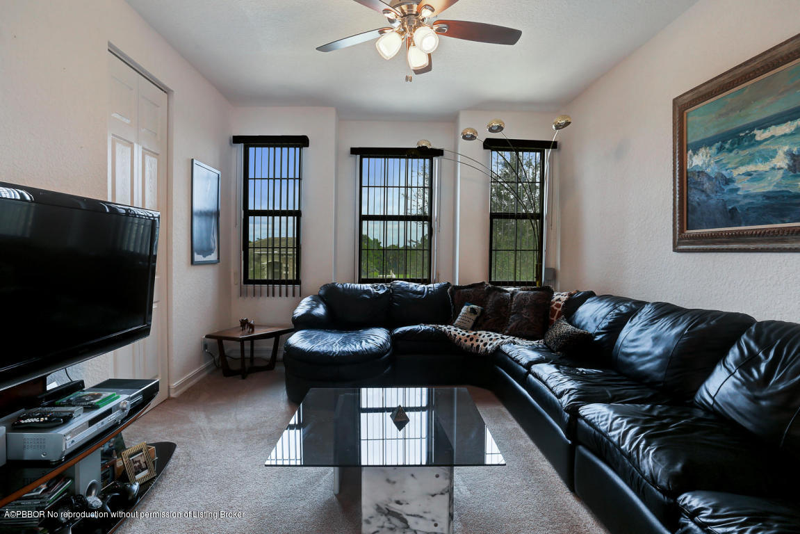 9831 Equus Circle Boynton Beach, FL 33472 - Photo 22 of 44 a living room with furniture and a flat screen tv