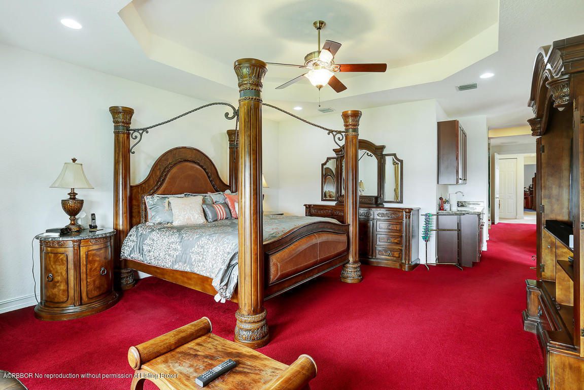 9831 Equus Circle Boynton Beach, FL 33472 - Photo 25 of 44 a bedroom with furniture and a mirror