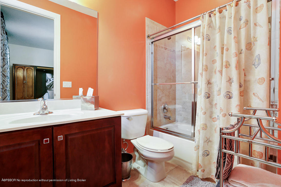 9831 Equus Circle Boynton Beach, FL 33472 - Photo 32 of 44 a bathroom with a sink a toilet and shower