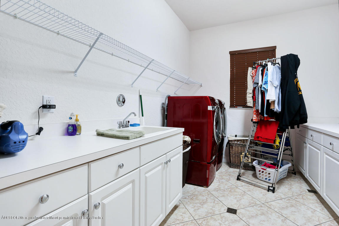 9831 Equus Circle Boynton Beach, FL 33472 - Photo 36 of 44 a room with storage and utility