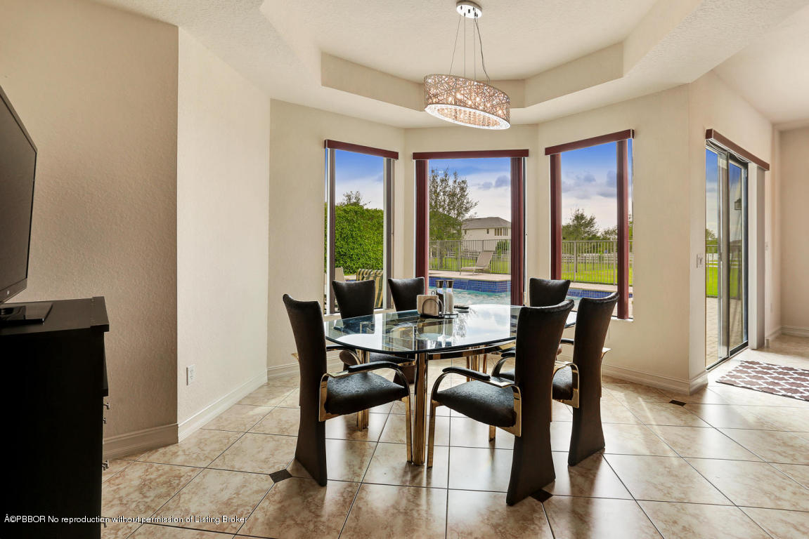 9831 Equus Circle Boynton Beach, FL 33472 - Photo 5 of 44 a view of a dining room with furniture window and outside view