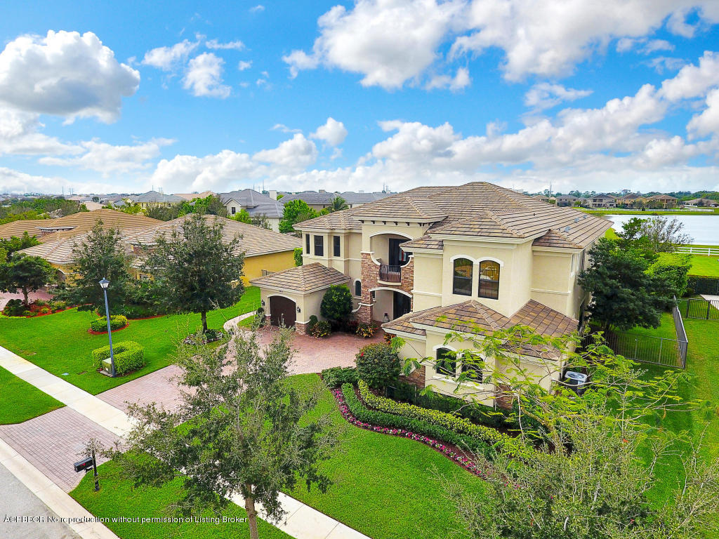 9831 Equus Circle Boynton Beach, FL 33472 - Photo 42 of 44 a aerial view of a house with swimming pool and garden