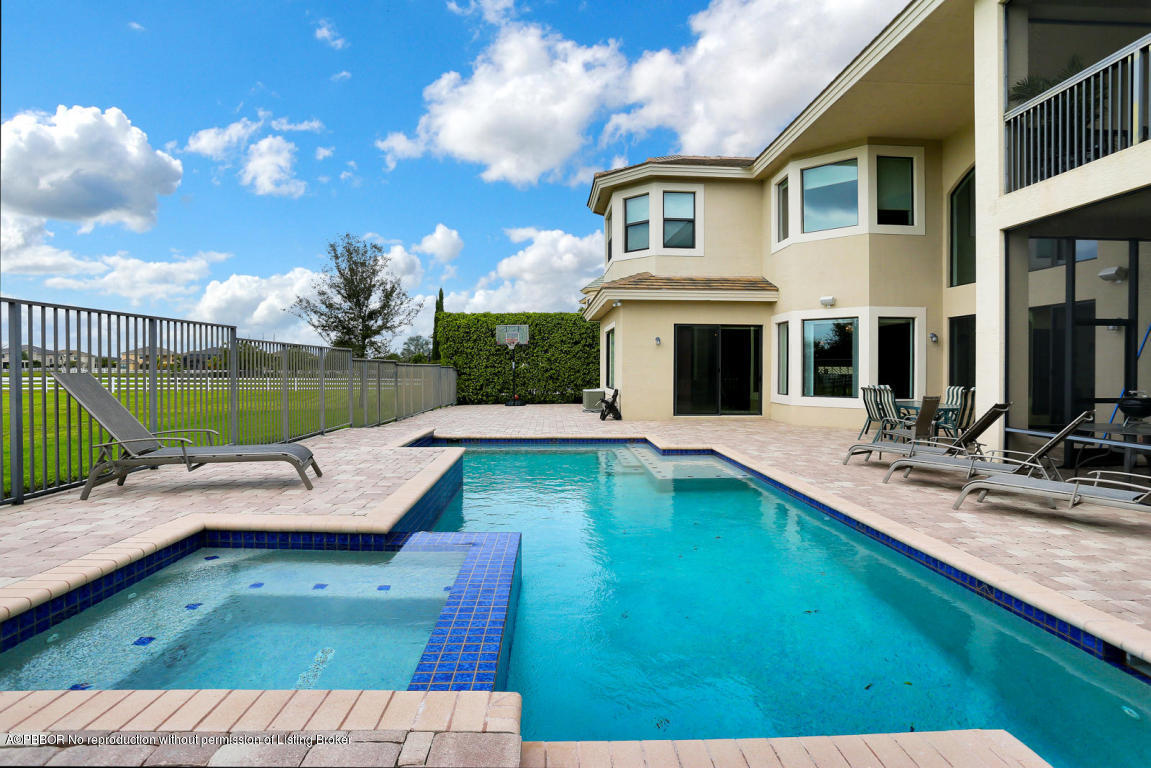 9831 Equus Circle Boynton Beach, FL 33472 - Photo 6 of 44 a view of a house with a swimming pool