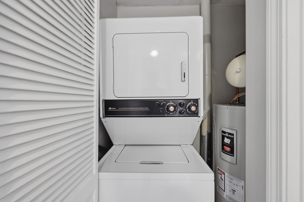 21 Middlesex Avenue, Unit 305 Worcester, MA 01604 - Photo 22 of 27 a utility room with dryer and washer