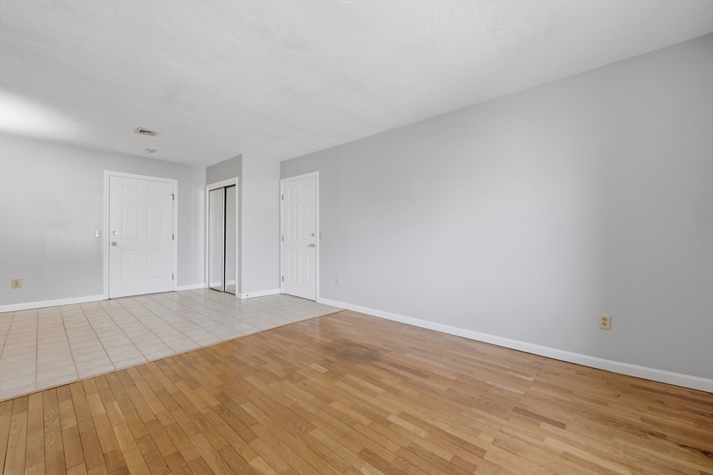 21 Middlesex Avenue, Unit 305 Worcester, MA 01604 - Photo 5 of 27 a view of an empty room and wooden floor