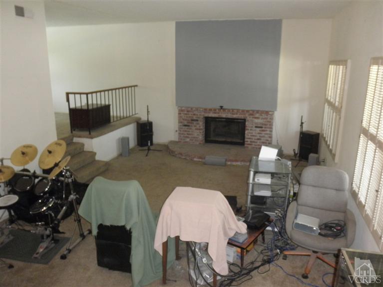 4181 Springfield Street Simi Valley, CA 93063 - Photo 10 of 13 a living room with furniture and a fireplace