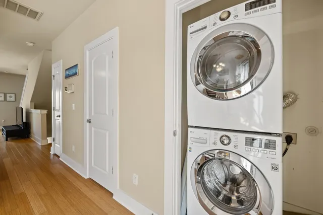 a view of a hallway with washer and dryer