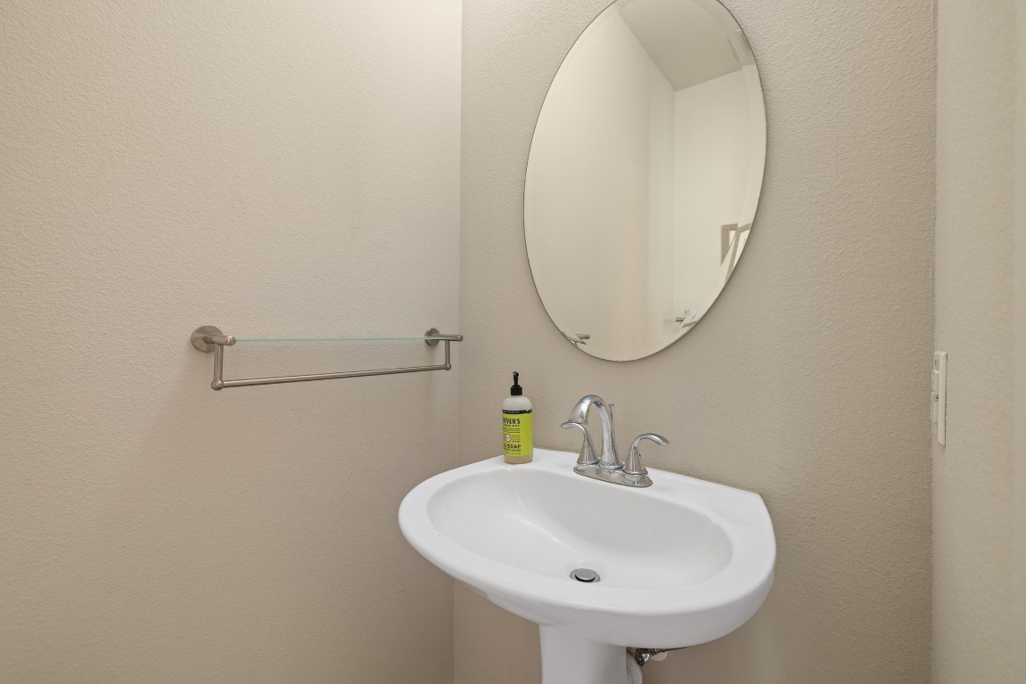 13420 Lyndhurst Street, Unit 806 Austin, TX 78717 - Photo 20 of 23 a bathroom with a sink and a mirror