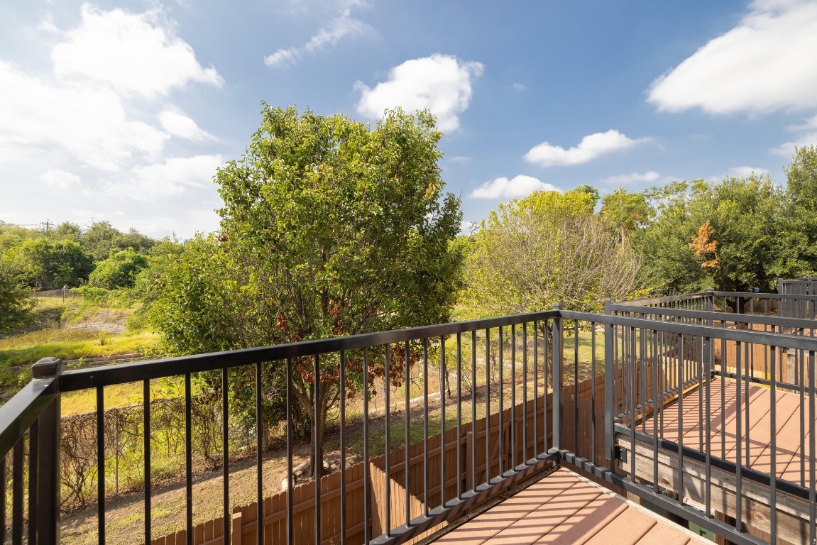 13420 Lyndhurst Street, Unit 806 Austin, TX 78717 - Photo 2 of 23 a view of a balcony with wooden fence