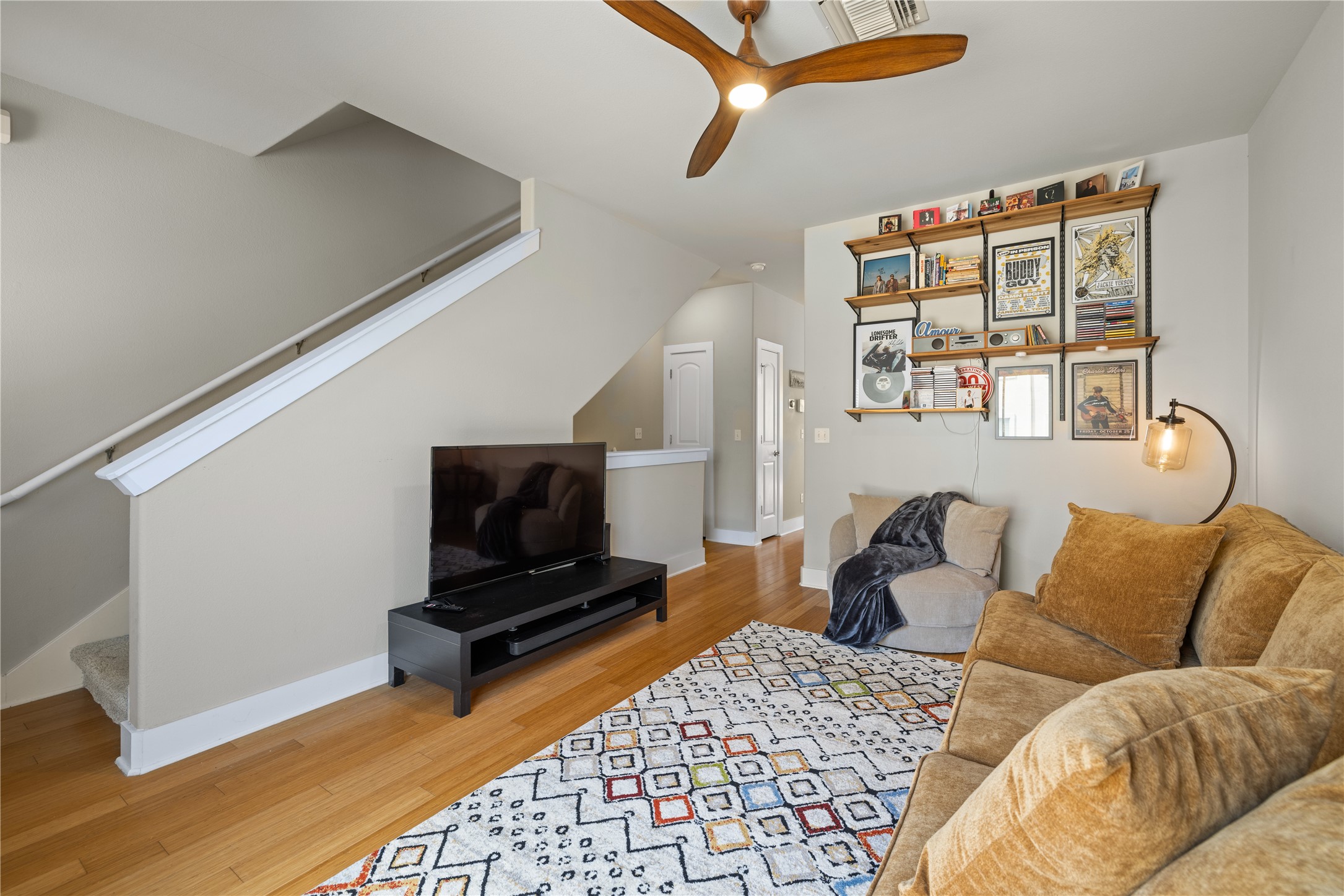 13420 Lyndhurst Street, Unit 806 Austin, TX 78717 - Photo 6 of 24 a living room with furniture a flat screen tv and a window