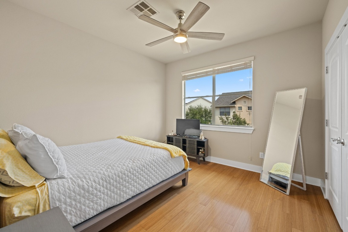 13420 Lyndhurst Street, Unit 806 Austin, TX 78717 - Photo 7 of 23 a bedroom with a bed and a window