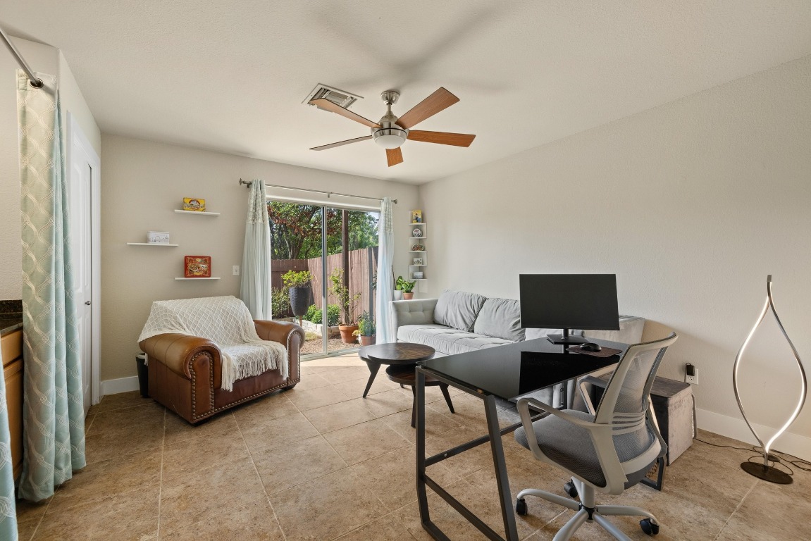 13420 Lyndhurst Street, Unit 806 Austin, TX 78717 - Photo 9 of 23 a living room with furniture and a window