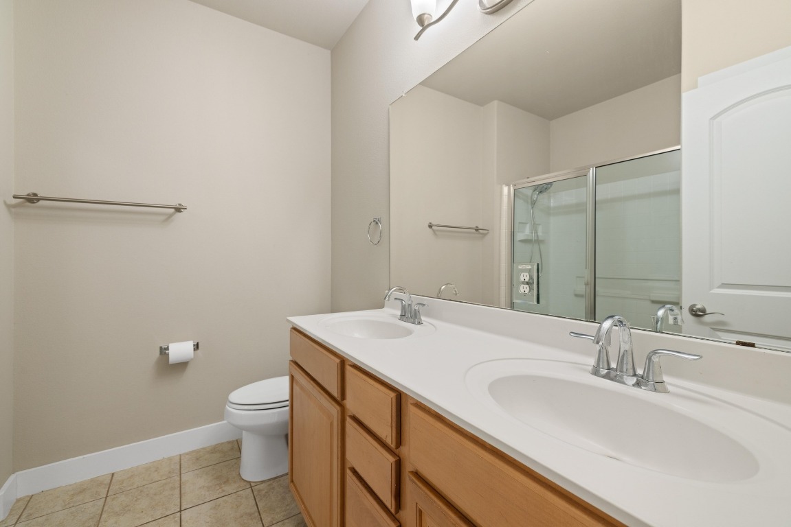 13420 Lyndhurst Street, Unit 806 Austin, TX 78717 - Photo 10 of 23 a bathroom with a sink toilet and vanity
