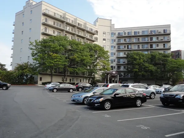 a view of a cars parked in front of a building