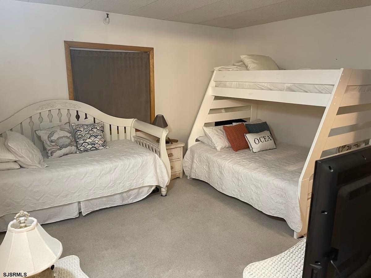 3901 Ocean Avenue, Unit 2 Brigantine, NJ 08203 - Photo 10 of 22 a bedroom with two bed and a window