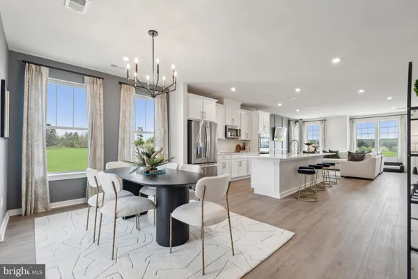 a view of house with swimming pool and yard