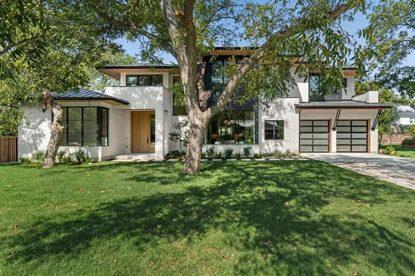 front view of a house with a yard