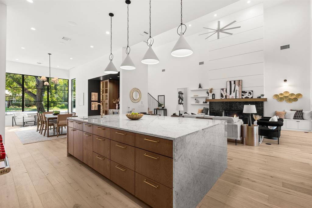 5908 Bull Creek Road Austin, TX 78757 - Photo 13 of 36 a large kitchen with kitchen island a large island in it