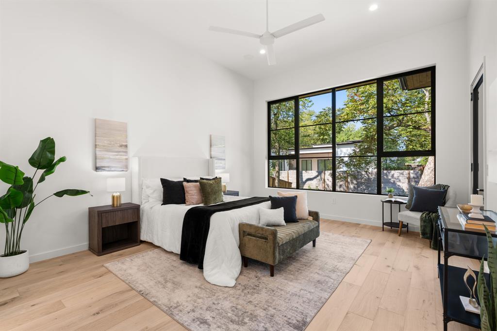 5908 Bull Creek Road Austin, TX 78757 - Photo 16 of 36 a bed room with a bed and a couch