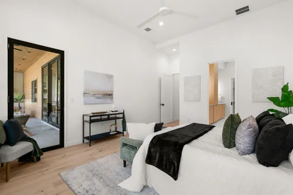 a bedroom with a bed and a couch