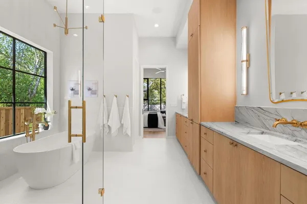 a bathroom with a double vanity sink and a mirror