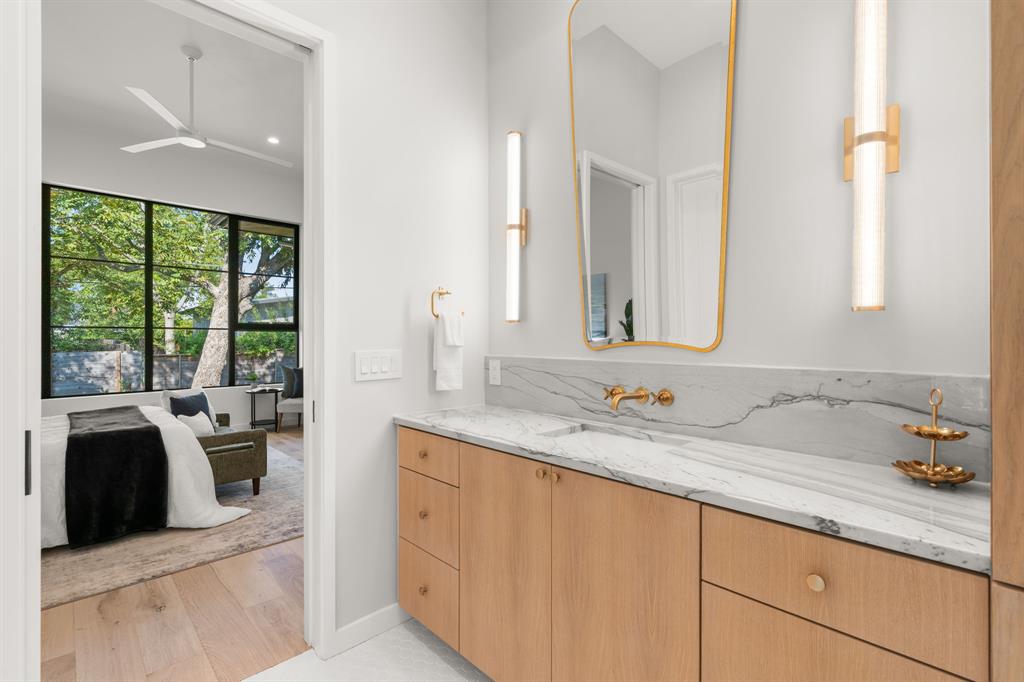 5908 Bull Creek Road Austin, TX 78757 - Photo 20 of 36 a bathroom with a sink and a mirror