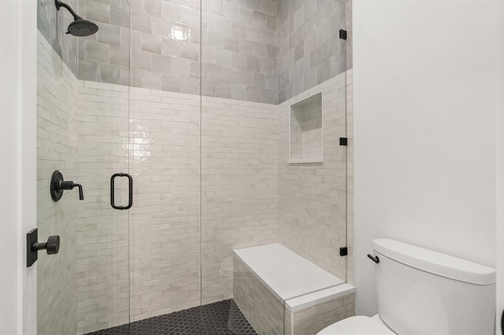 5908 Bull Creek Road Austin, TX 78757 - Photo 27 of 36 a bathroom with a shower and toilet