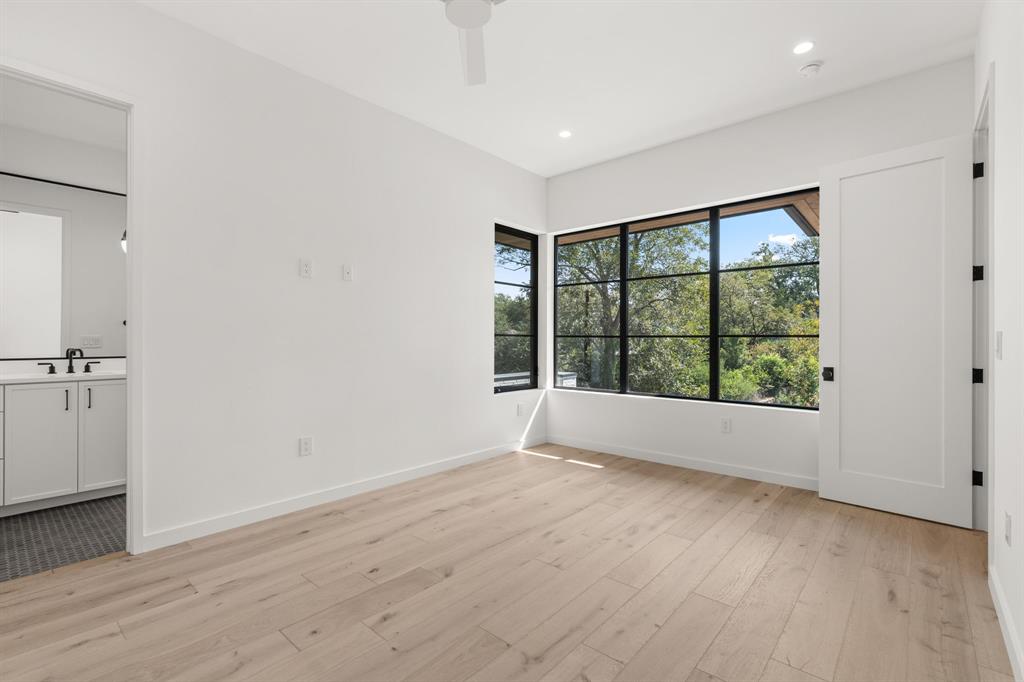 5908 Bull Creek Road Austin, TX 78757 - Photo 28 of 36 wooden floor in an empty room with a window