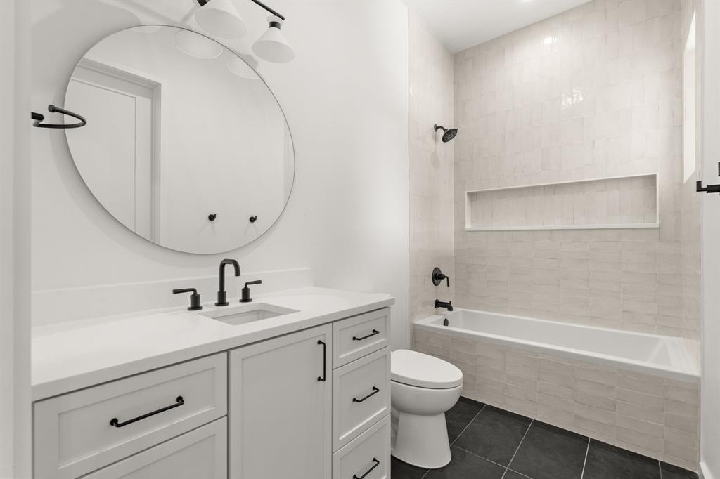 5908 Bull Creek Road Austin, TX 78757 - Photo 31 of 36 a bathroom with a sink a toilet and shower