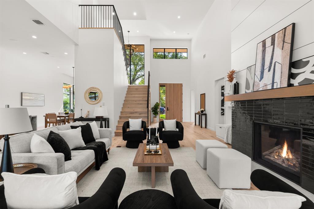 5908 Bull Creek Road Austin, TX 78757 - Photo 7 of 36 a living room with furniture fireplace and a large window