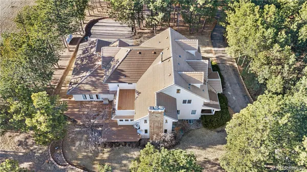 an aerial view of a residential apartment building with a yard