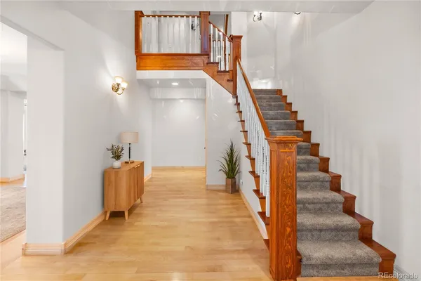 a view of an entryway with wooden floor