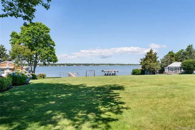 a view of a large body of water with a building in the background